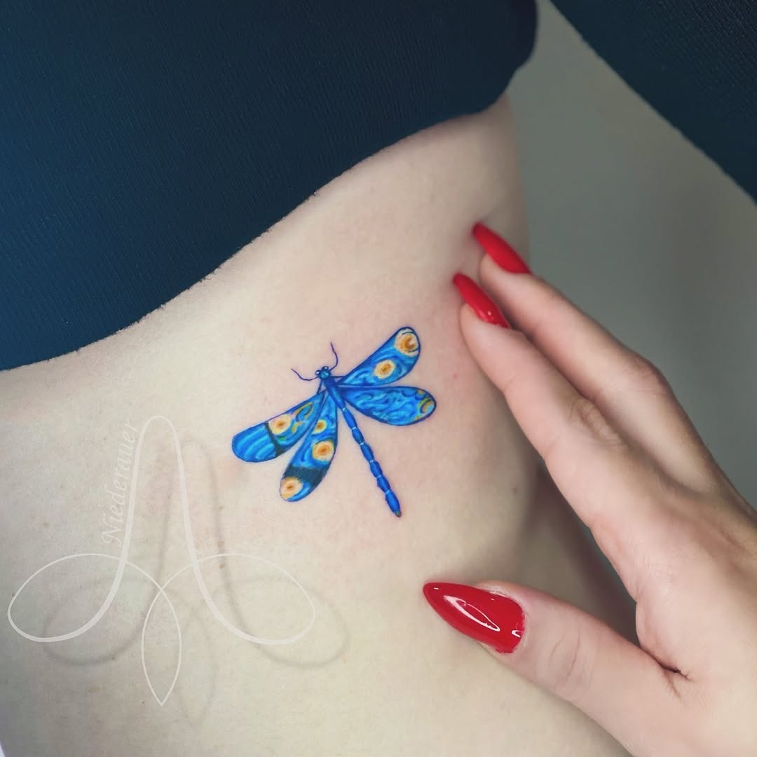A vibrant dragonfly tattoo inspired by Van Gogh Tattoo Design