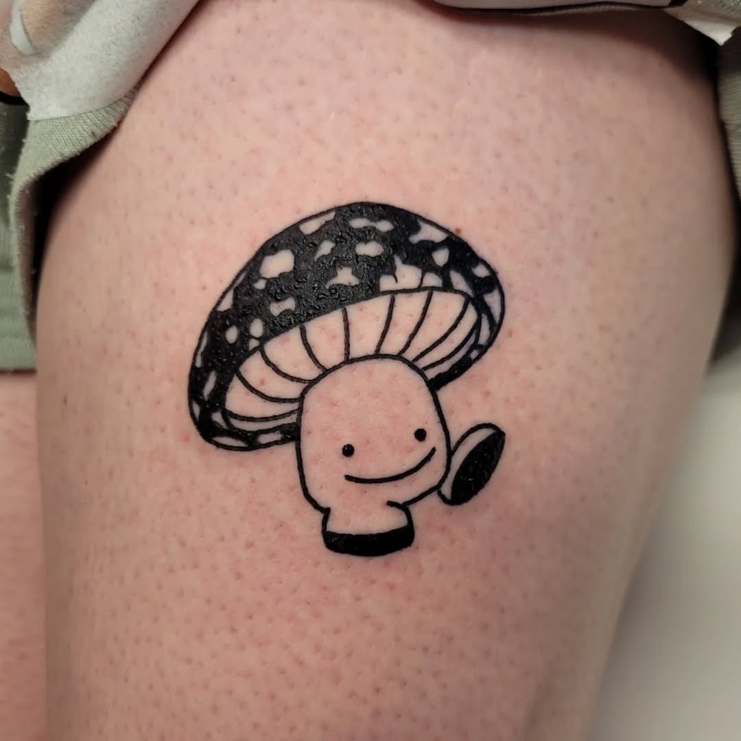 Adorable mushroom tattoo with a whimsical design Tattoo Design