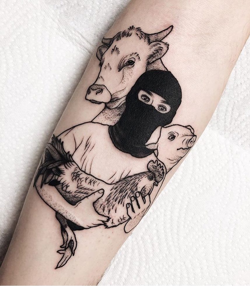 Artistic Expression of Veganism and Animal Rights Tattoo Design