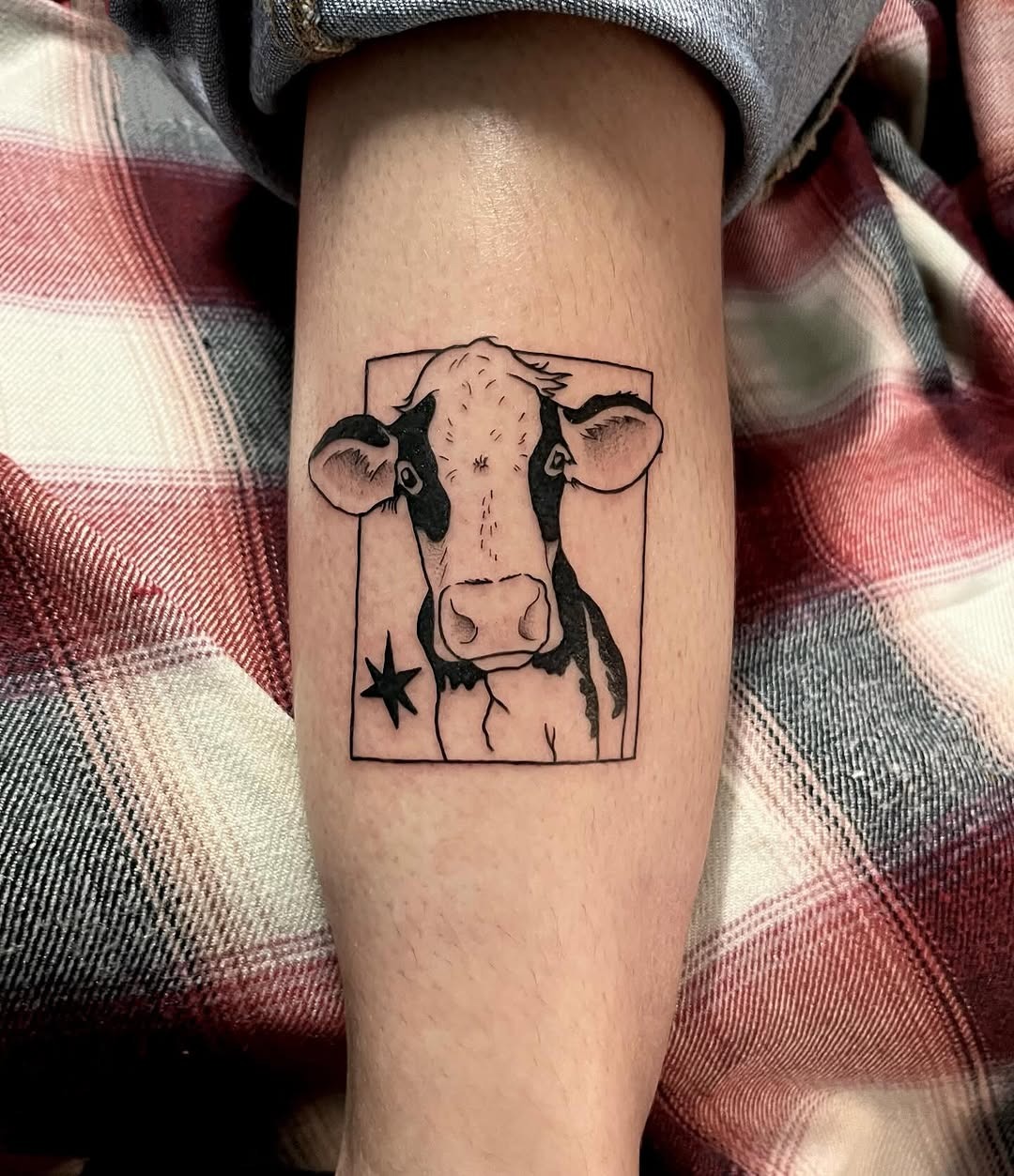 Charming cow tattoo with artistic flair Tattoo Design