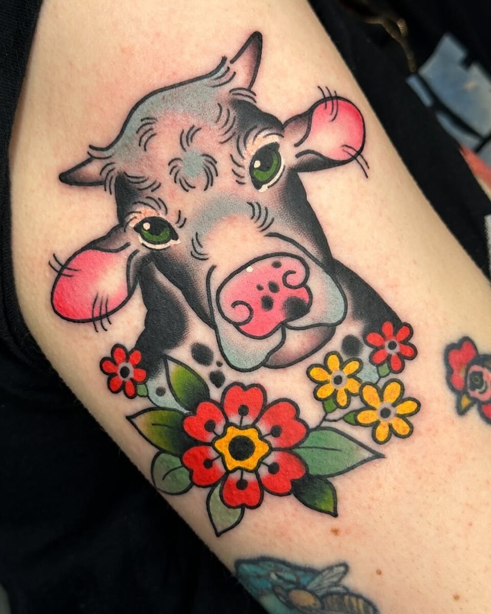 Charming cow tattoo with vibrant floral details Tattoo Design