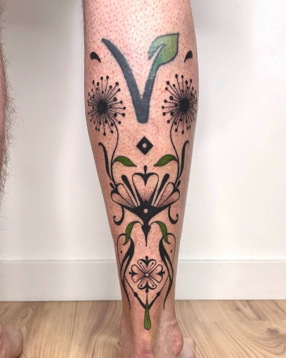Elegant vegan tattoo with floral motifs Tattoo Design