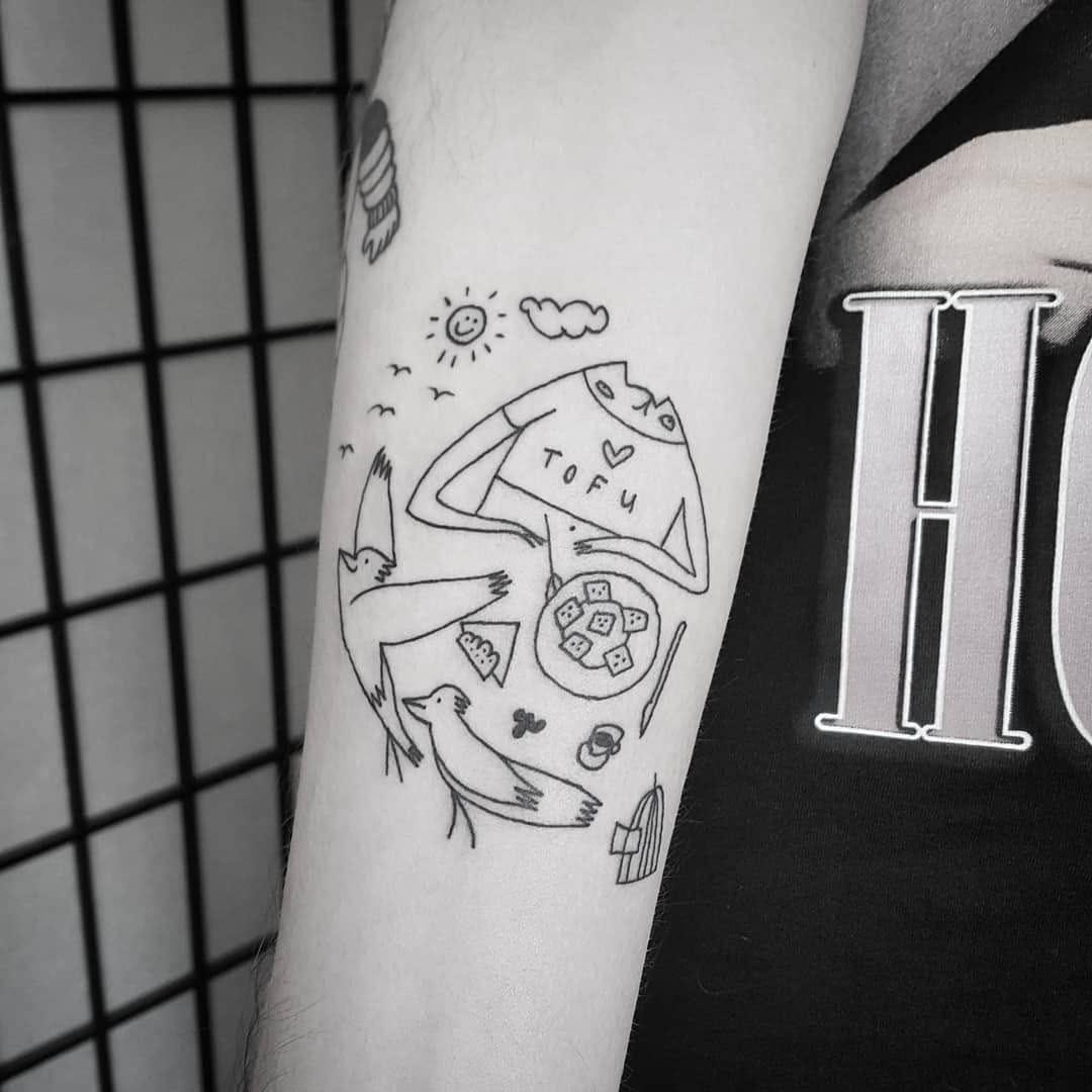 Playful vegan-themed tattoo with birds and tofu Tattoo Design