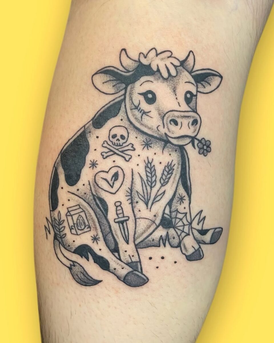 Whimsical cow tattoo with playful elements Tattoo Design