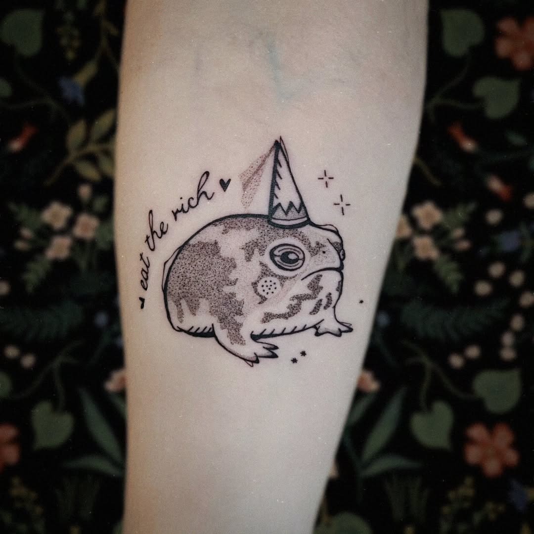 Whimsical frog tattoo with a party hat Tattoo Design