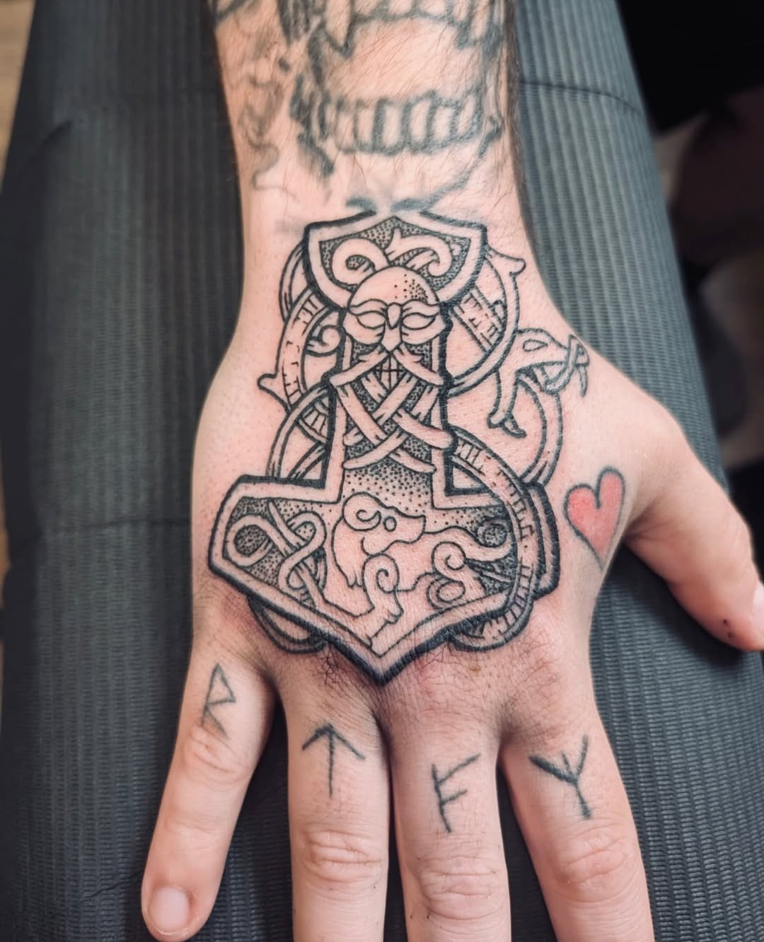 Intricate Viking knot tattoo on a hand Tattoo Design