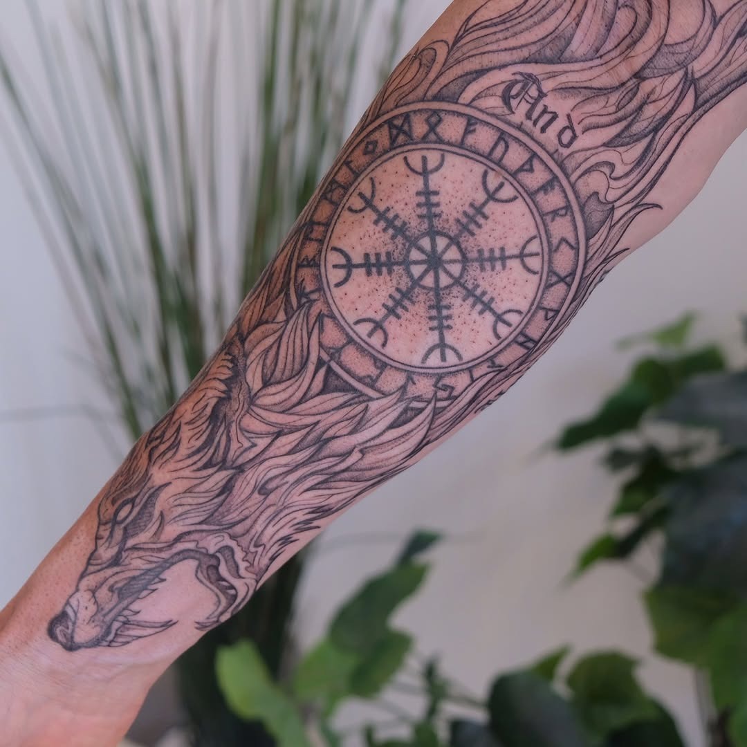 Intricate Viking tattoo featuring a wolf and symbol Tattoo Design