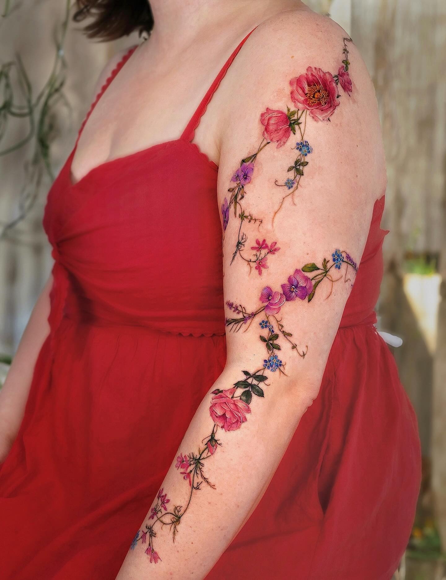 Blossoms on Her Arm Vine Tattoo Tattoo Design