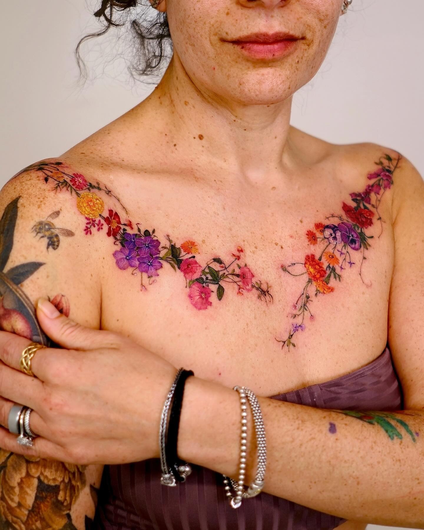 Colorful Floral Vine Tattoo Across Collarbone and Shoulder Tattoo Design