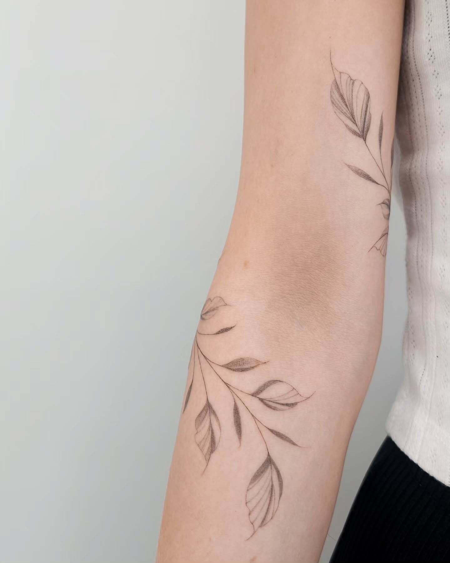 Fine Line Vine Tattoo Around the Elbow Tattoo Design