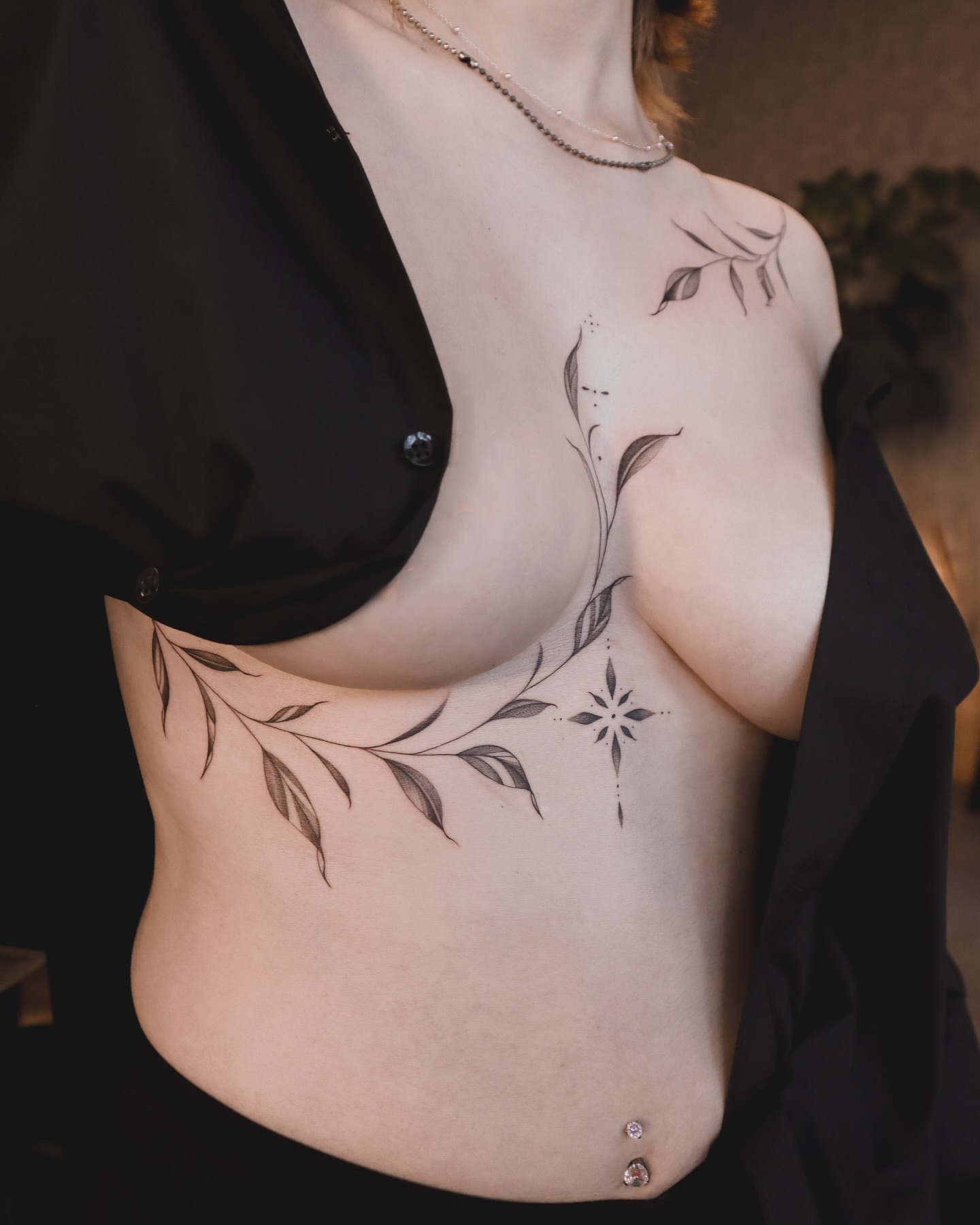 Floral Vine and Star Tattoo on Ribcage and Chest Tattoo Design