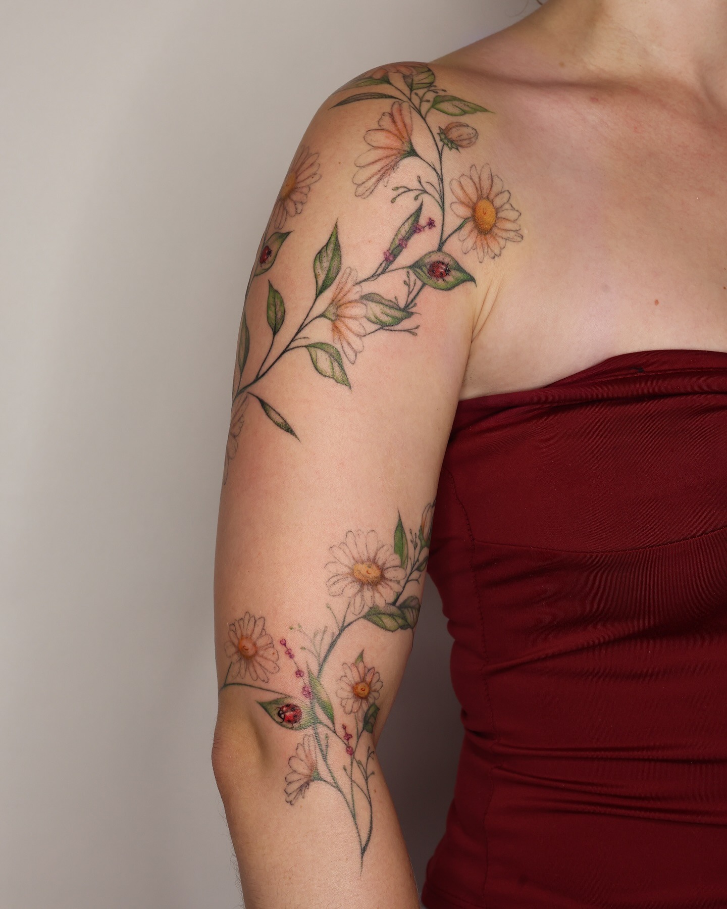 Floral Vine Tattoo with Daisies and Ladybugs Tattoo Design