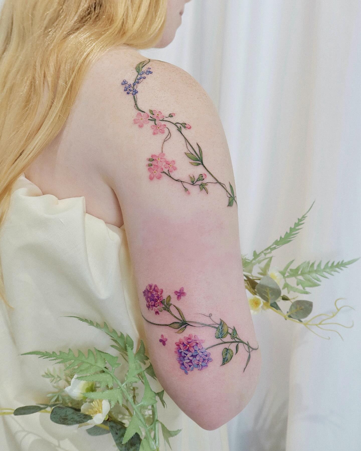 Floral Vine Tattoo with Daisies, Hydrangeas, and Forget-Me-Nots Tattoo Design