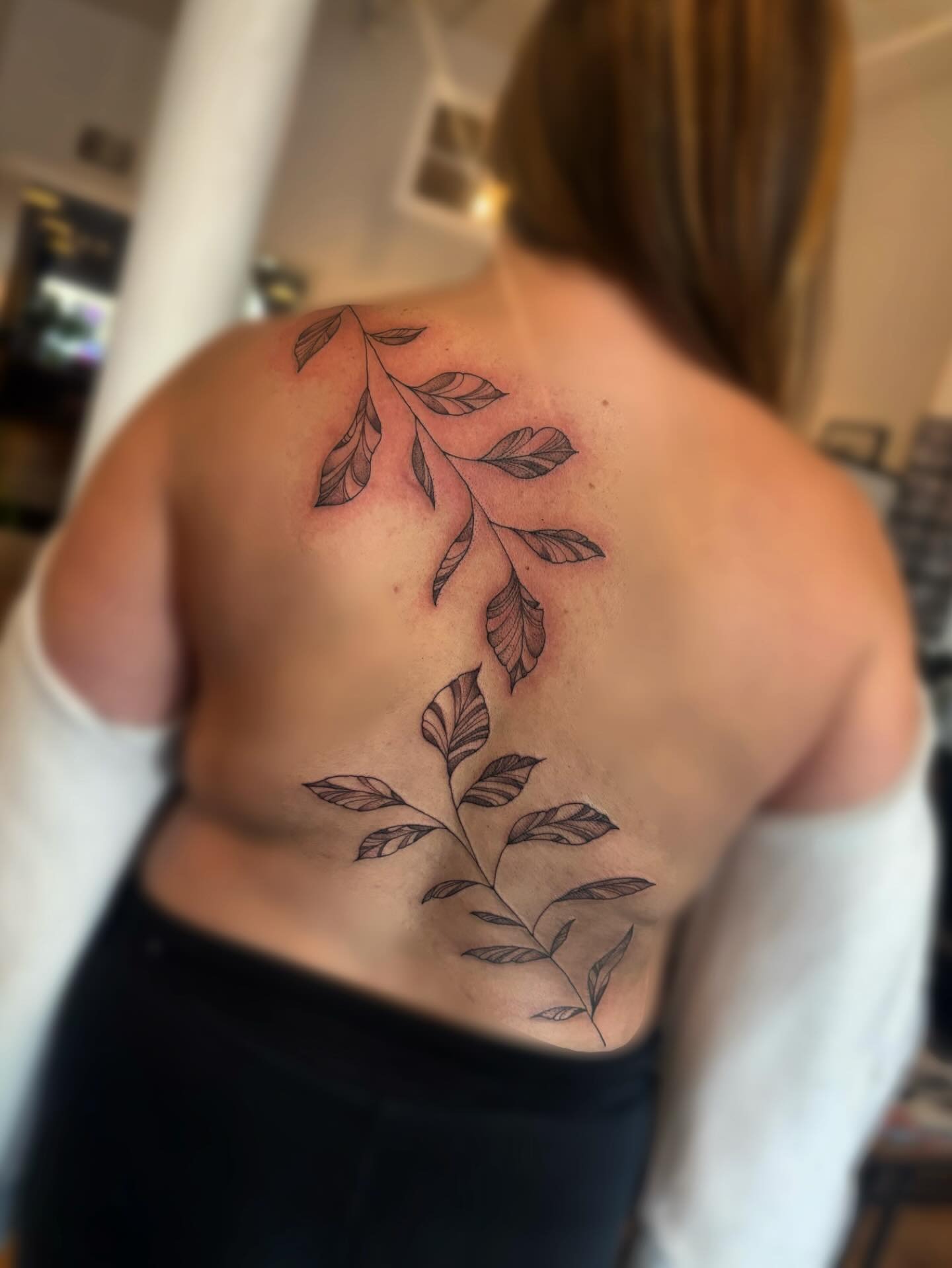 Flowing Vine Tattoo Along the Back Tattoo Design