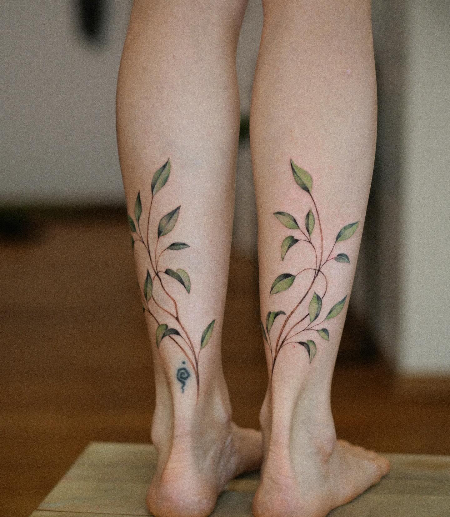 Matching Vine Tattoos on the Calves Tattoo Design