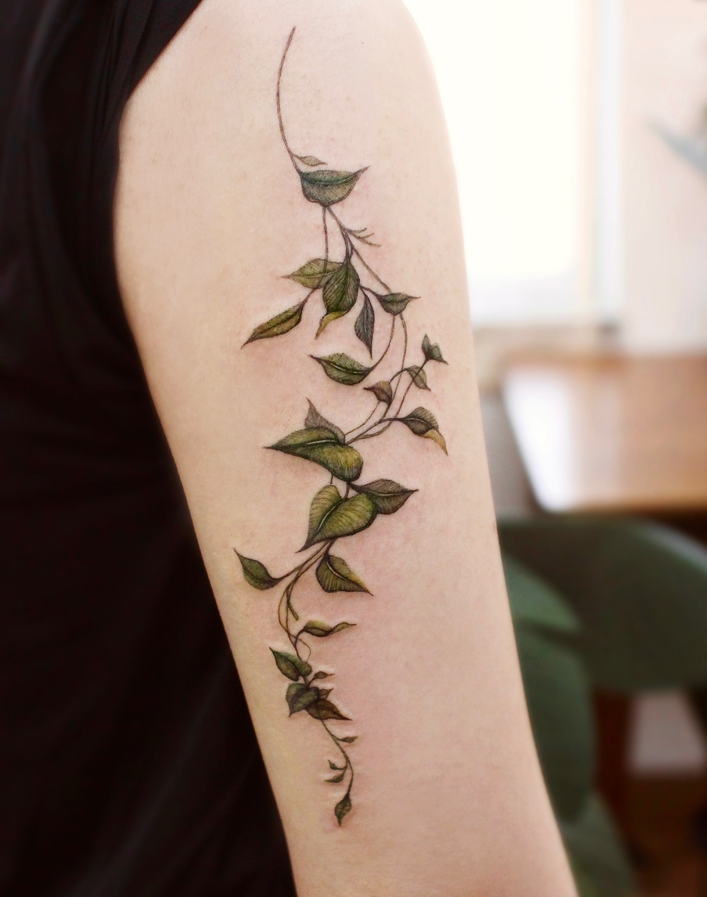 Trailing Vine Tattoo on the Upper Arm Tattoo Design