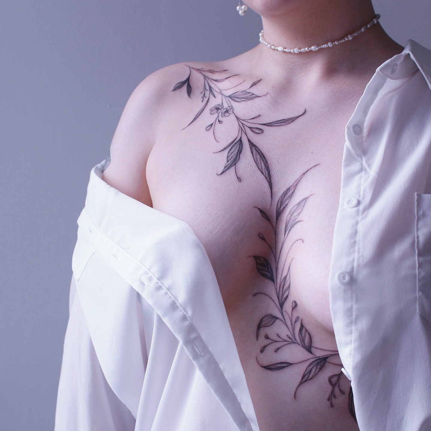 Vine Tattoo Flowing Across Chest and Shoulder Tattoo Design