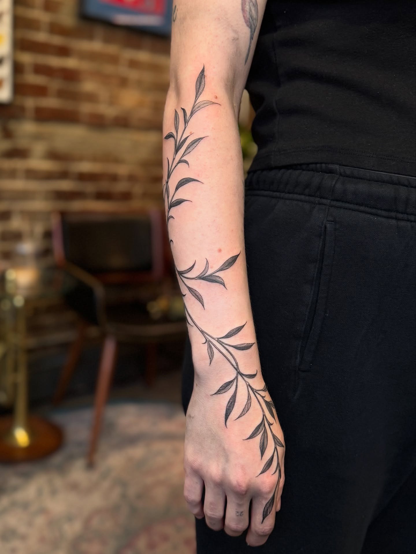 Vine Tattoo Flowing from Forearm to Hand Tattoo Design