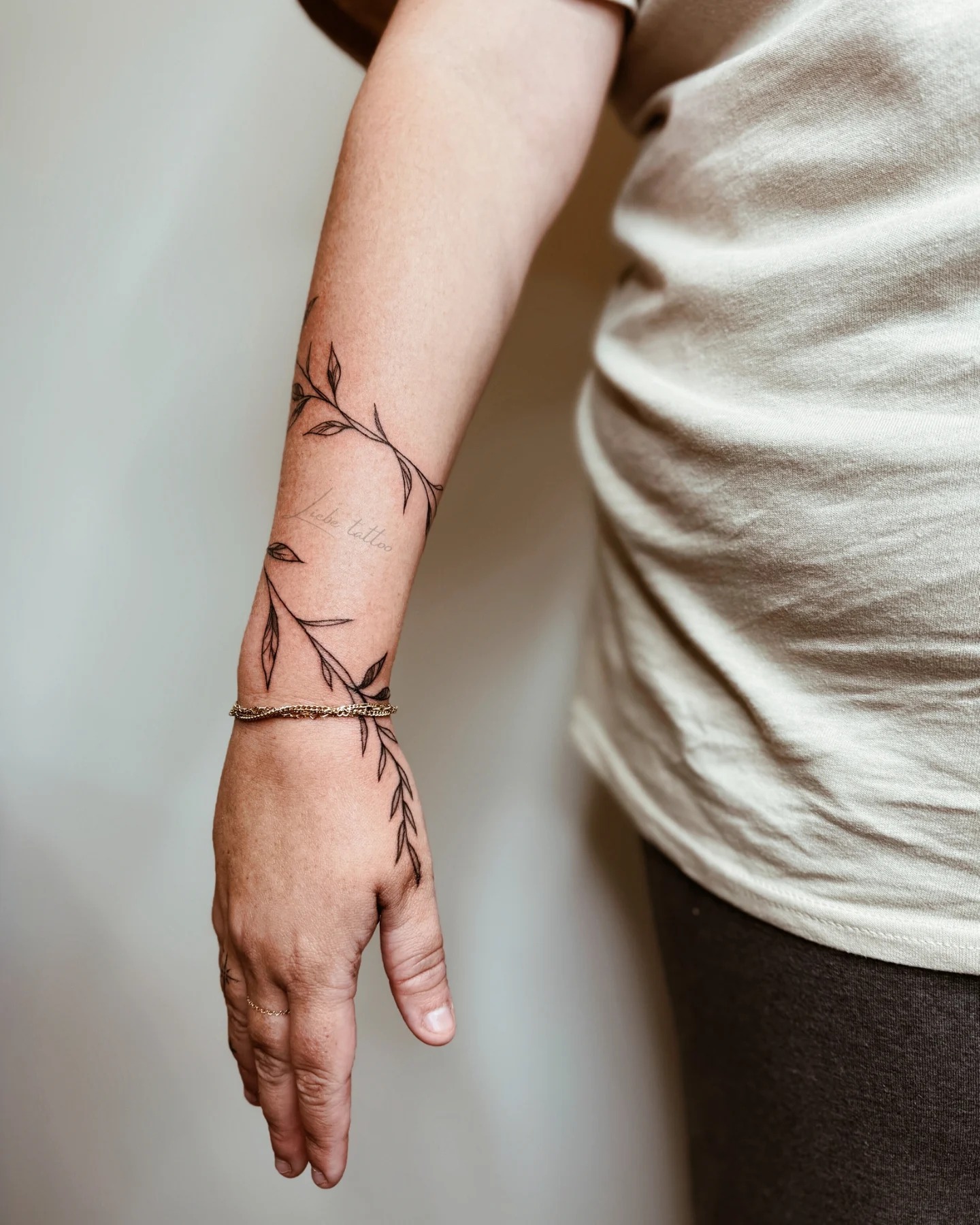 Vine Tattoo Wrapping Around Forearm and Hand Tattoo Design
