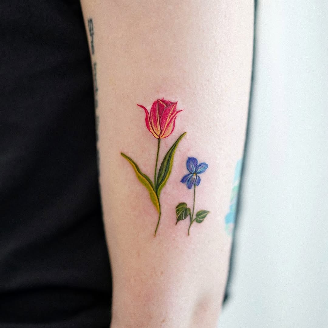 Delicate floral tattoos with a splash of violet Tattoo Design
