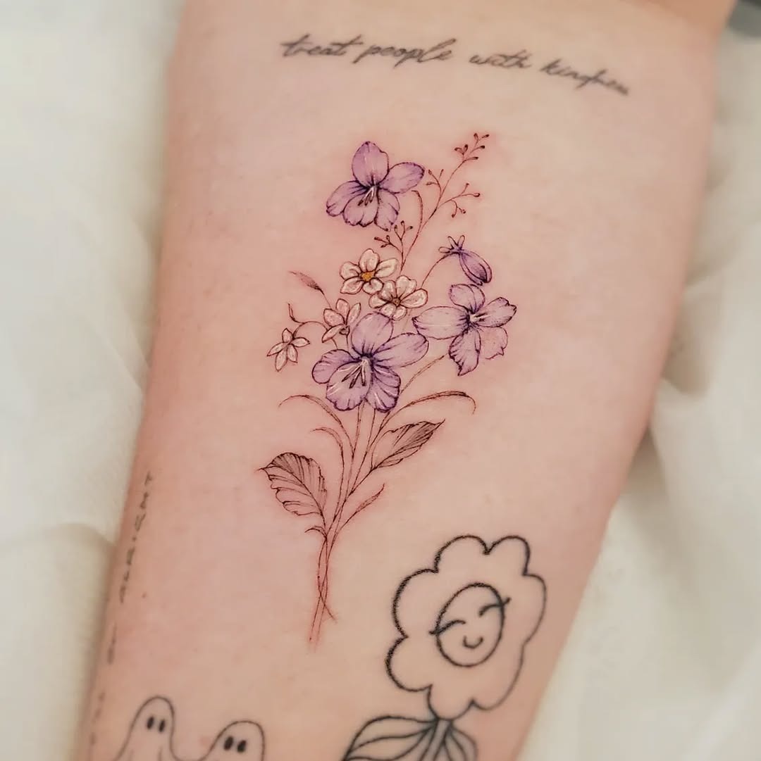 Delicate violet floral tattoo showcasing artistry Tattoo Design