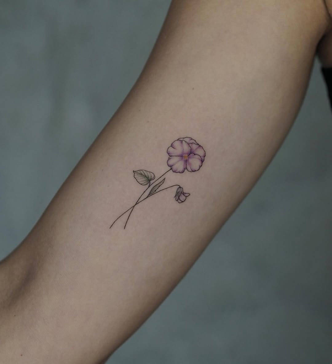 Delicate violet flower tattoo on inner arm Tattoo Design
