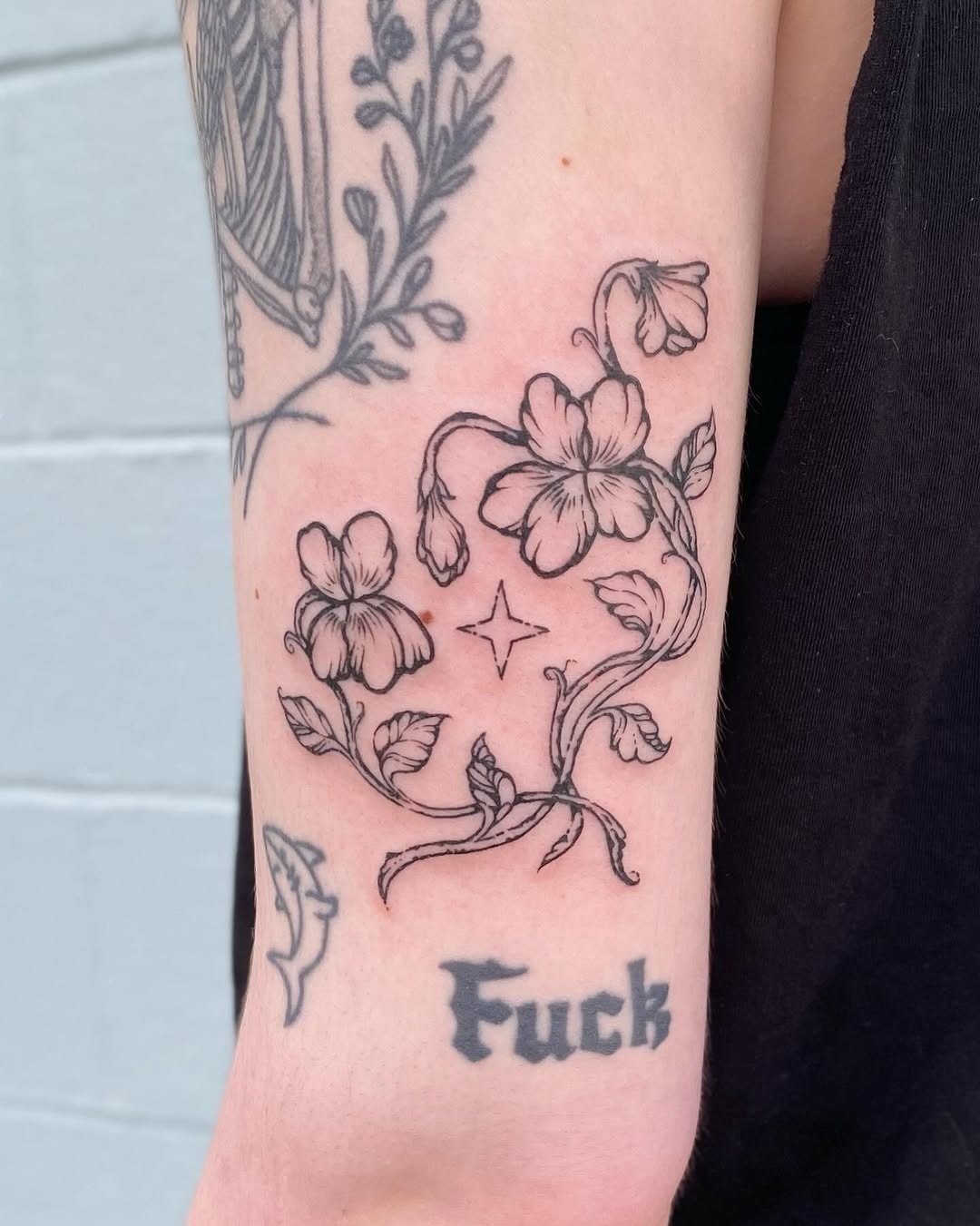 Elegant violet floral tattoo design with text Tattoo Design