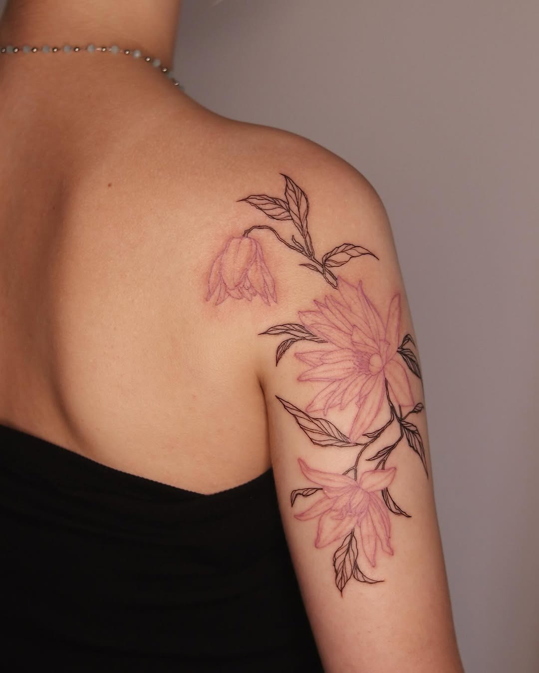 Elegant violet floral tattoo on the arm Tattoo Design