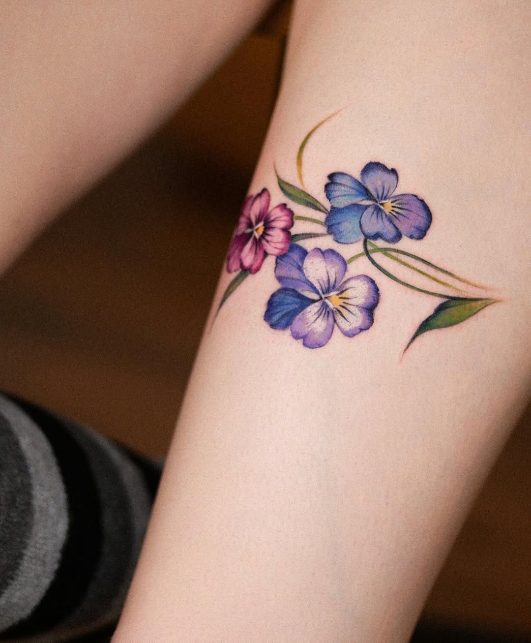Elegant violet flowers tattoo on the leg Tattoo Design