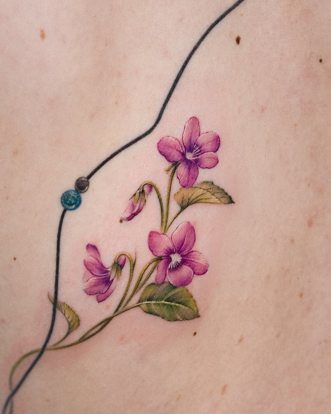 Elegant violet flowers with intricate details Tattoo Design