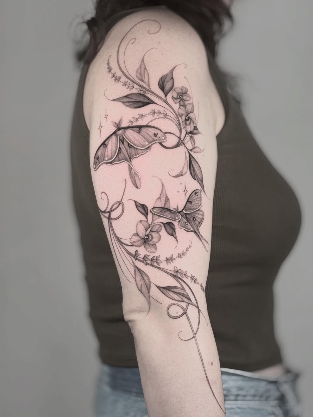 Elegant violet tattoo with floral and moth details Tattoo Design
