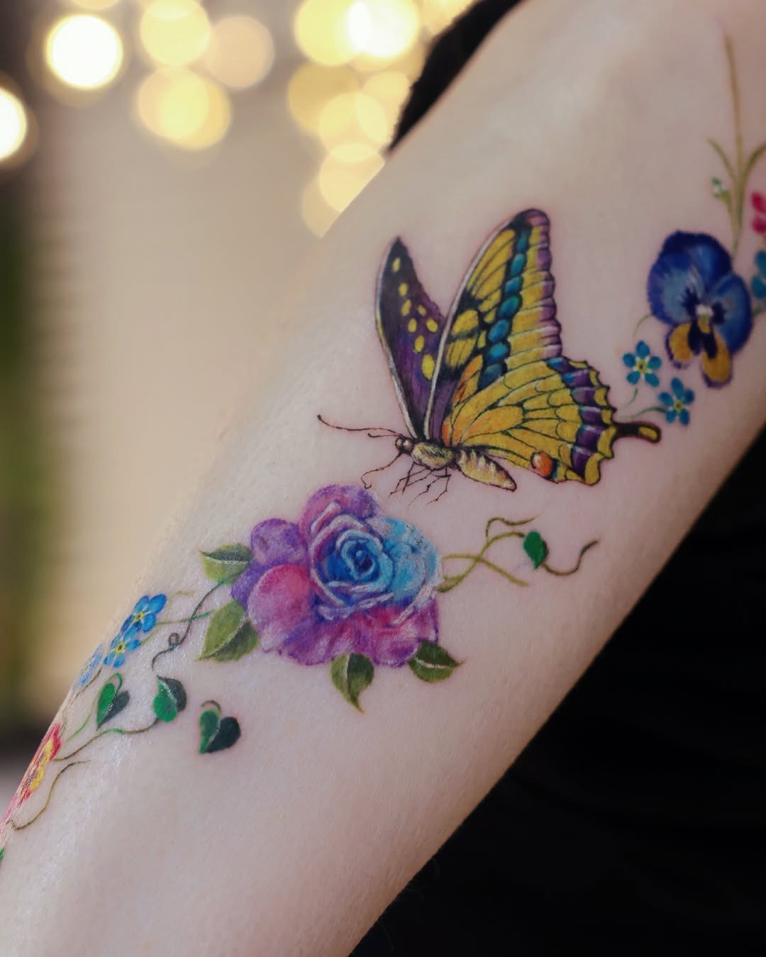 Vibrant violet butterfly and floral tattoo design Tattoo Design