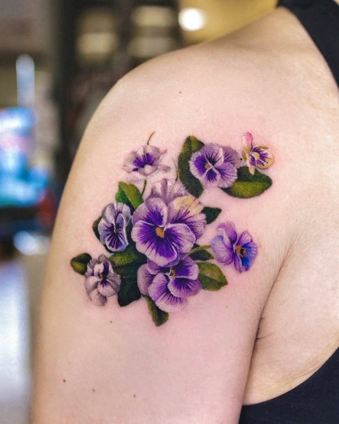 Vibrant violet flower tattoo showcases nature’s beauty Tattoo Design