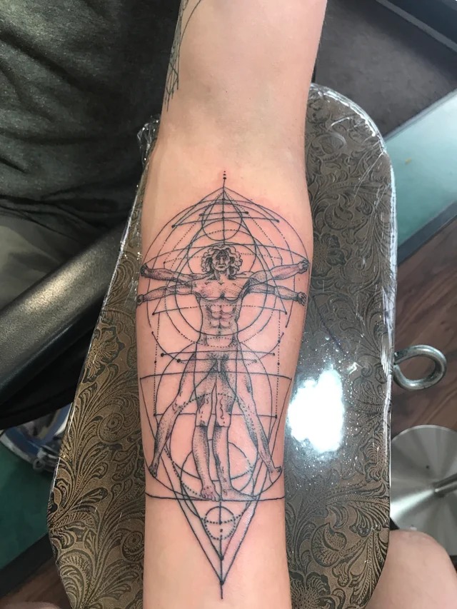Forearm Focus on Precision and Balance Tattoo Design