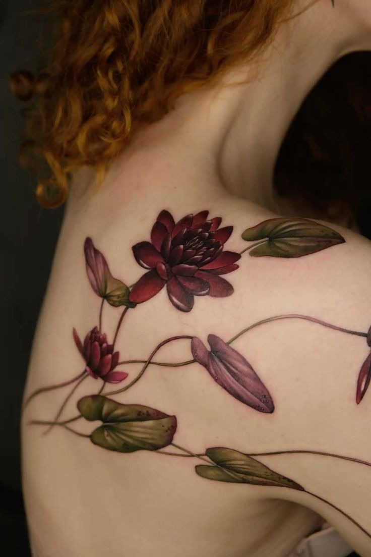Deep Red Water Lilies Across the Shoulder and Back Tattoo Design