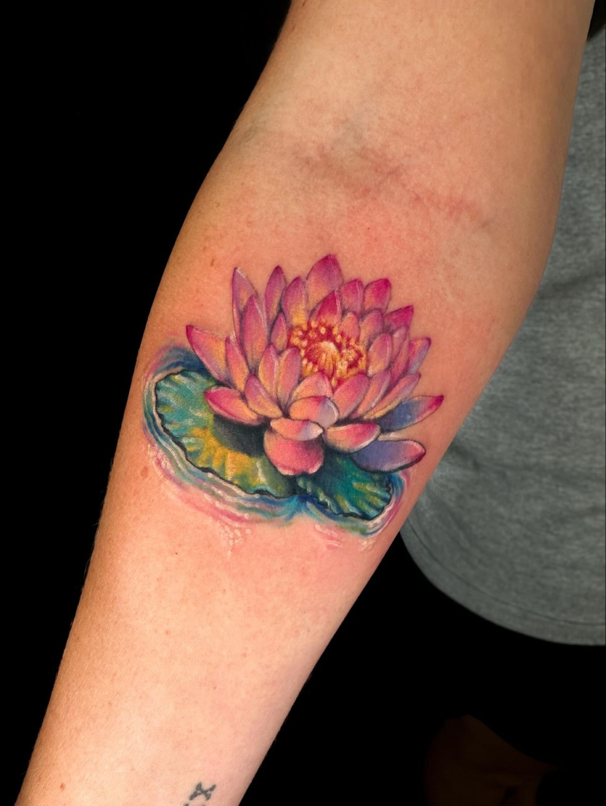 Jewel-Toned Water Lily with a Lily Pad Tattoo Design