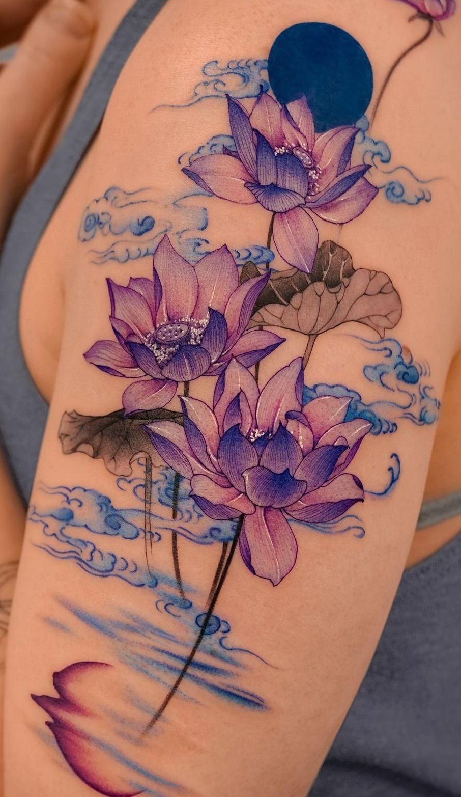 Purple Water Lilies with Blue Clouds Tattoo Design