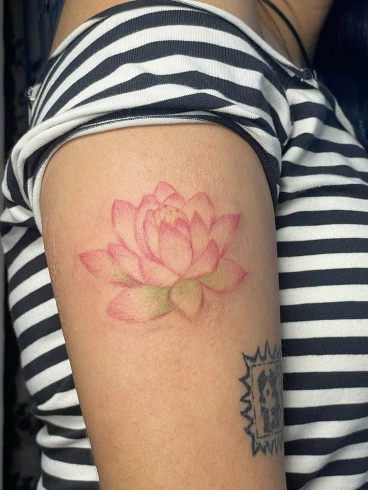 Soft Pink Water Lily on the Upper Arm Tattoo Design