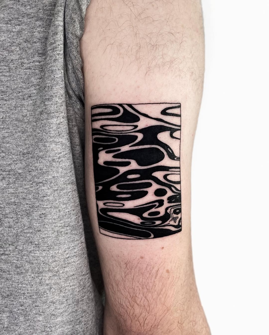 Abstract water tattoo in bold black ink Tattoo Design