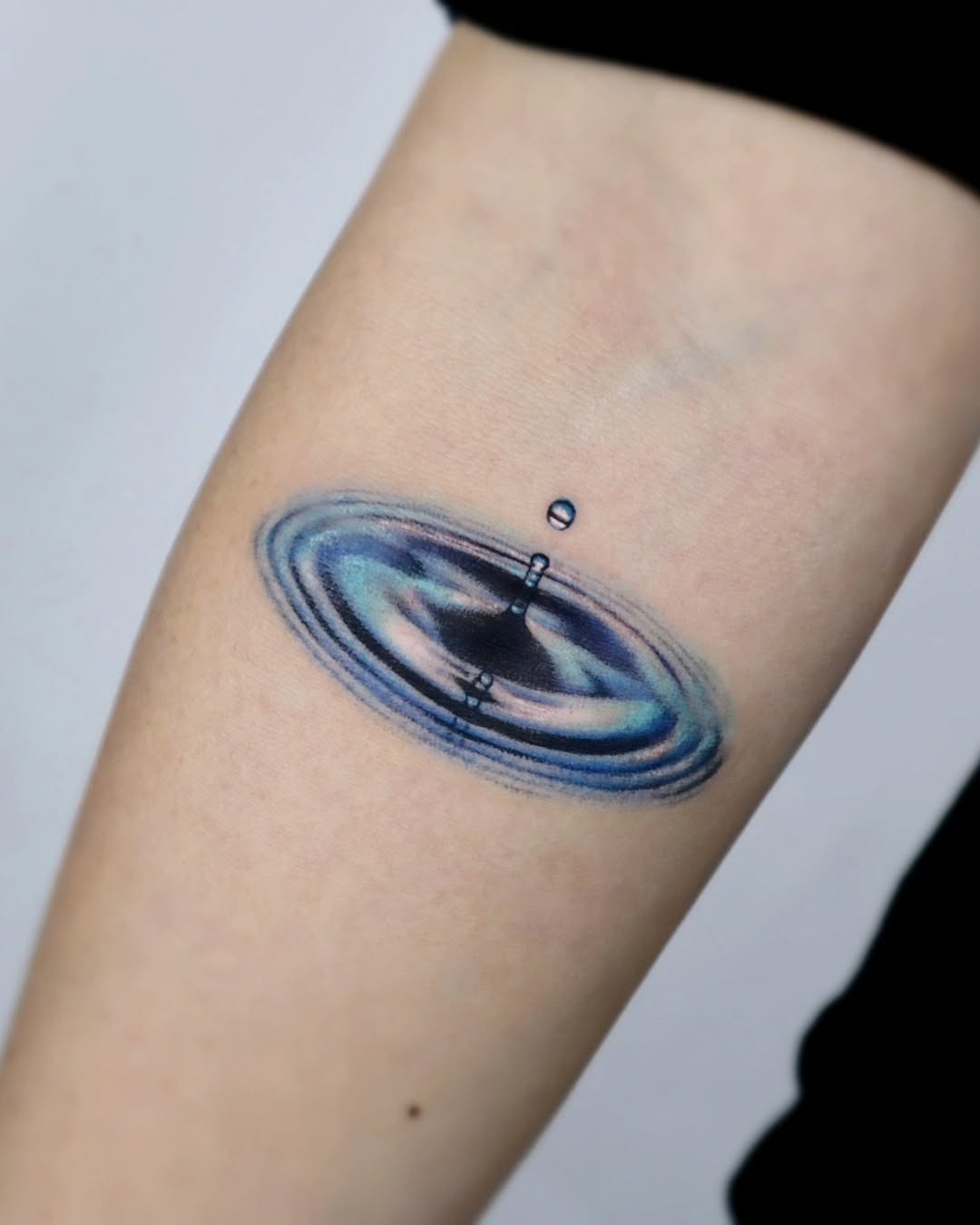 Captivating water ripple tattoo design on arm Tattoo Design