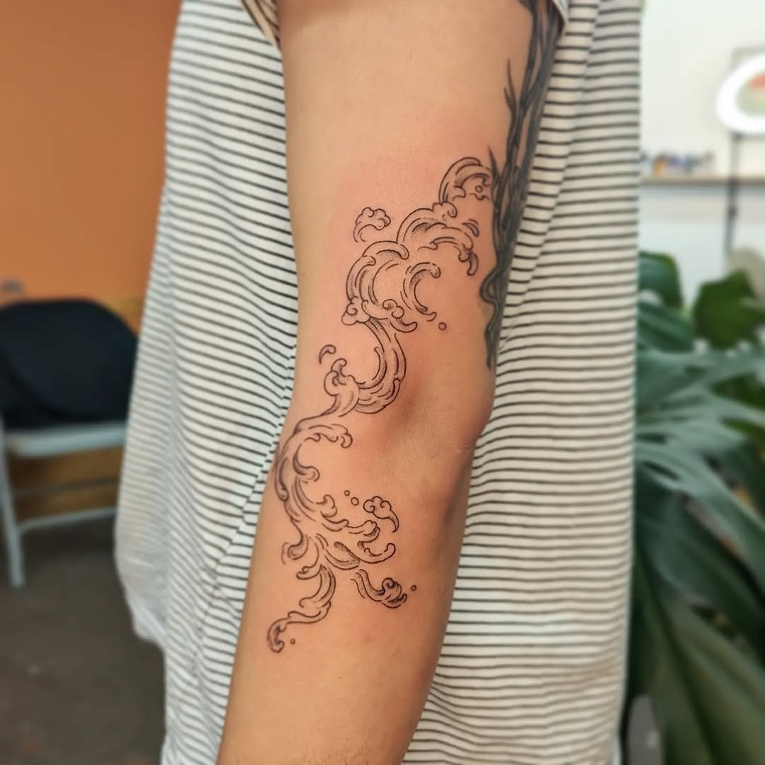 Elegant swirls reminiscent of ocean waves Tattoo Design