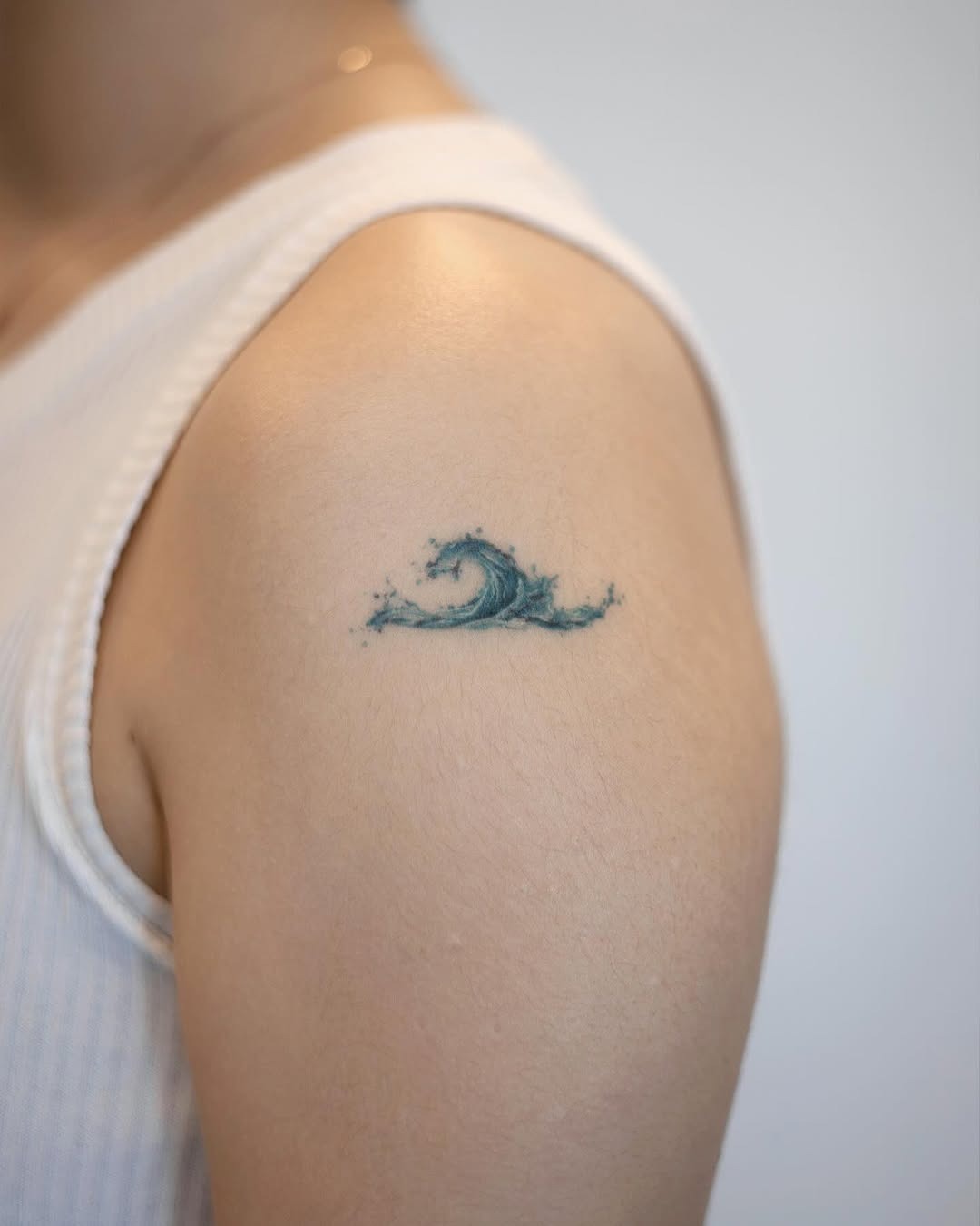 Elegant wave tattoo on the shoulder Tattoo Design