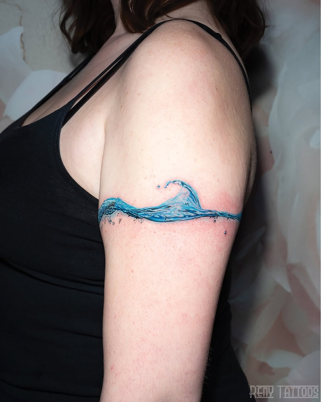 Elegant wave tattoo on the upper arm Tattoo Design