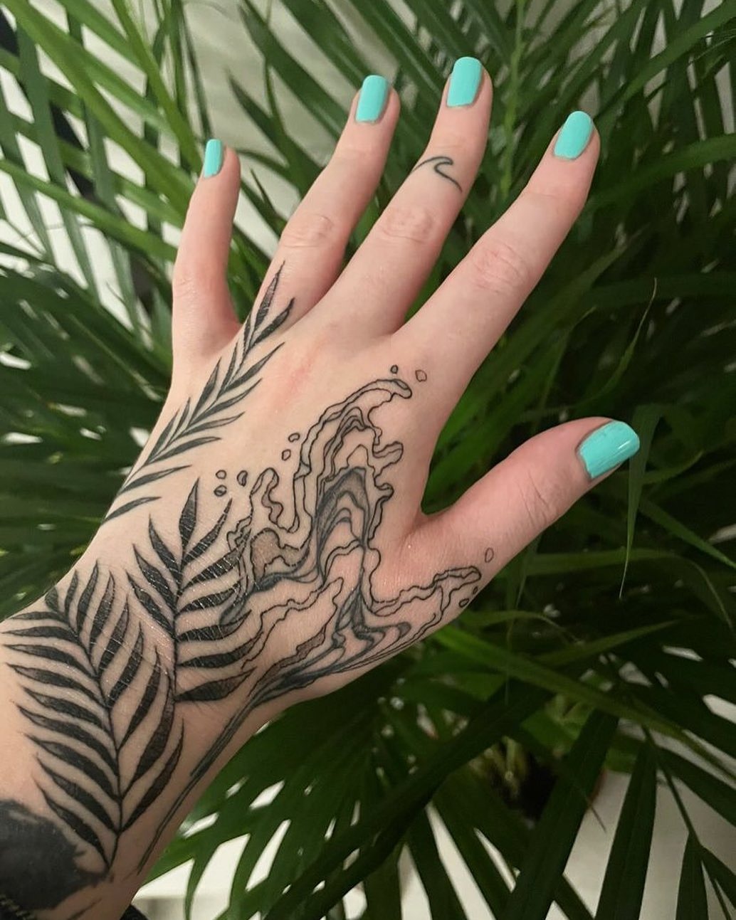 Flowing water tattoo meets elegant foliage design Tattoo Design