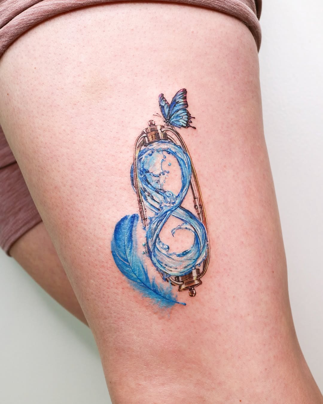 Fluid art meets infinity design in tattoos Tattoo Design