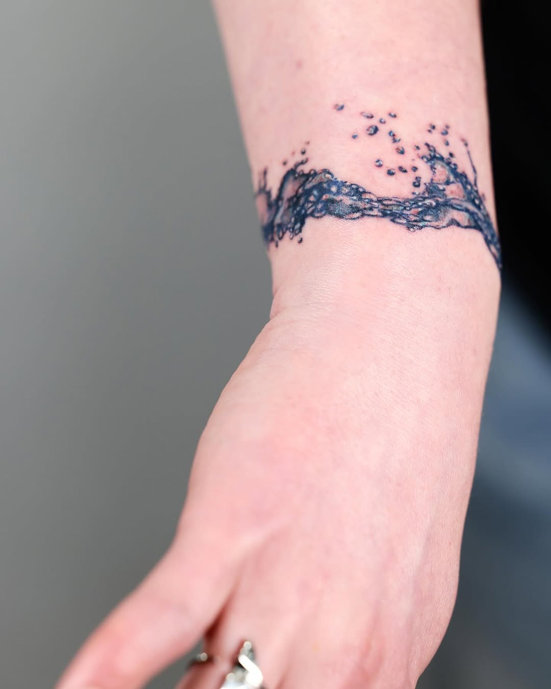 Graceful waves captured in a stunning tattoo Tattoo Design