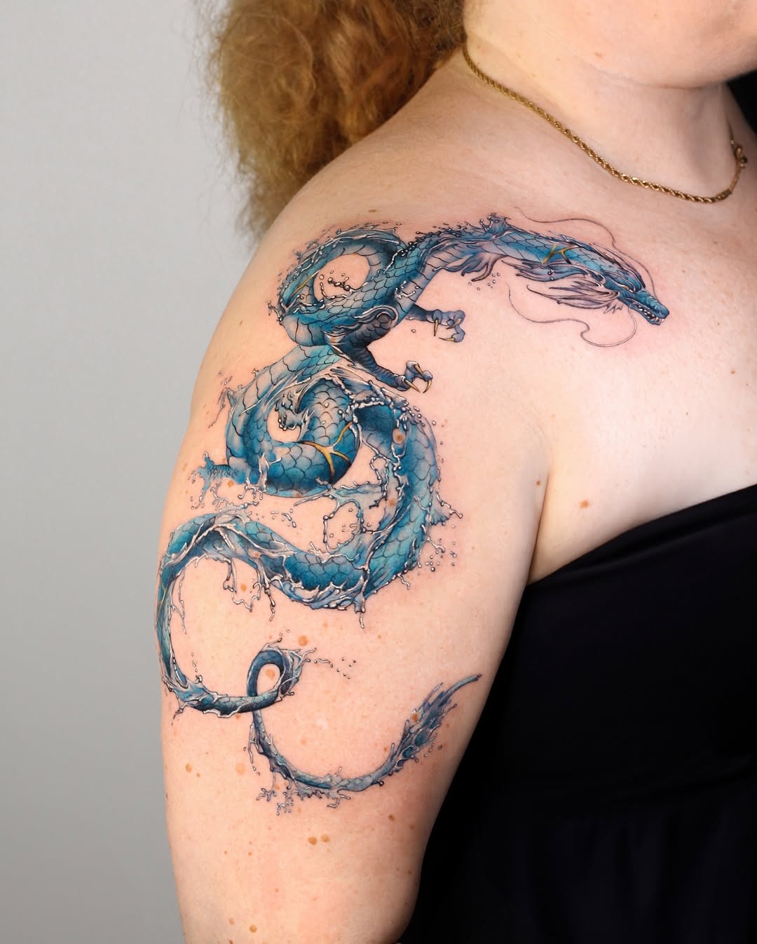 Intricate water dragon tattoo with fluid design Tattoo Design