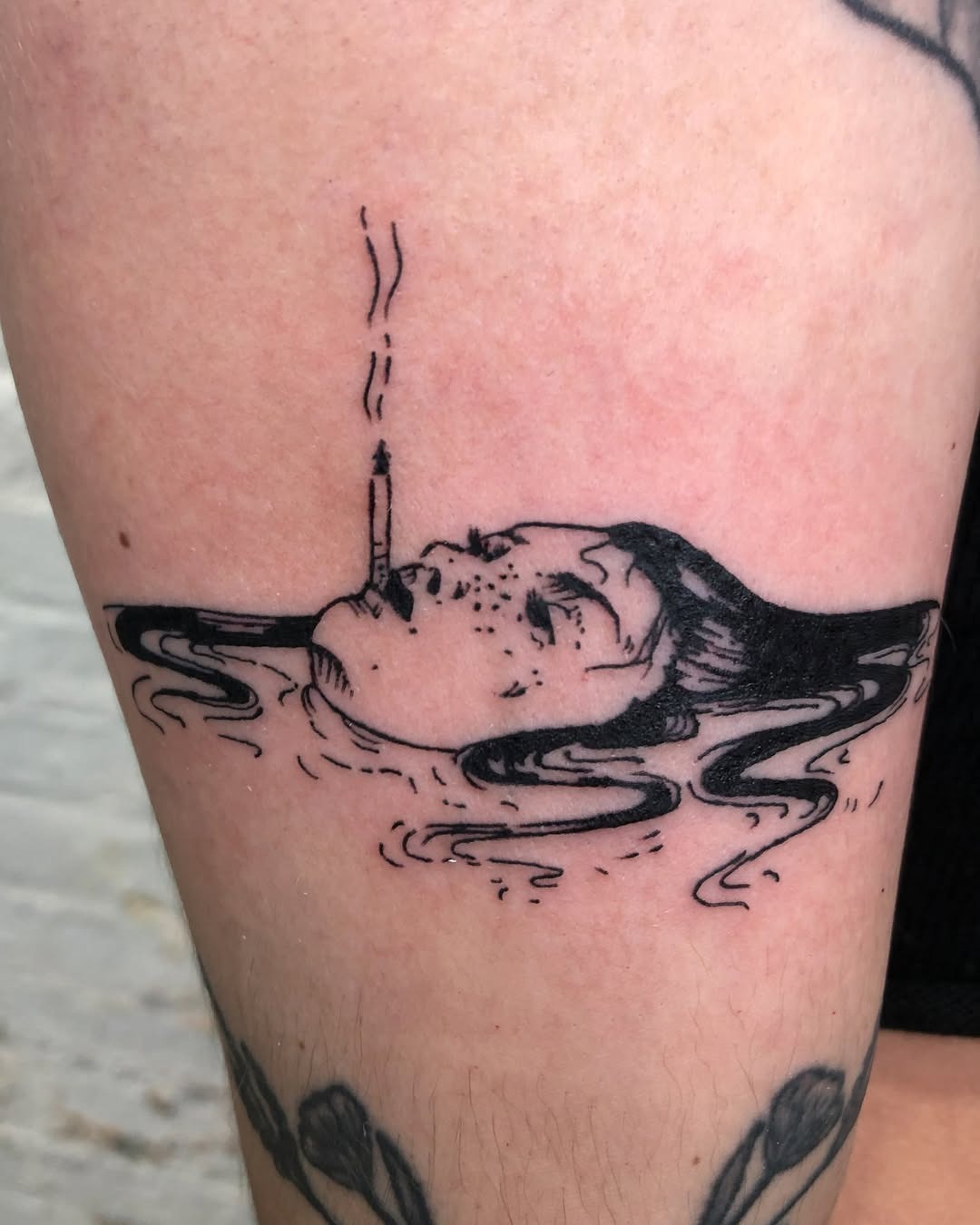 Sinking figure with a cigarette in water Tattoo Design