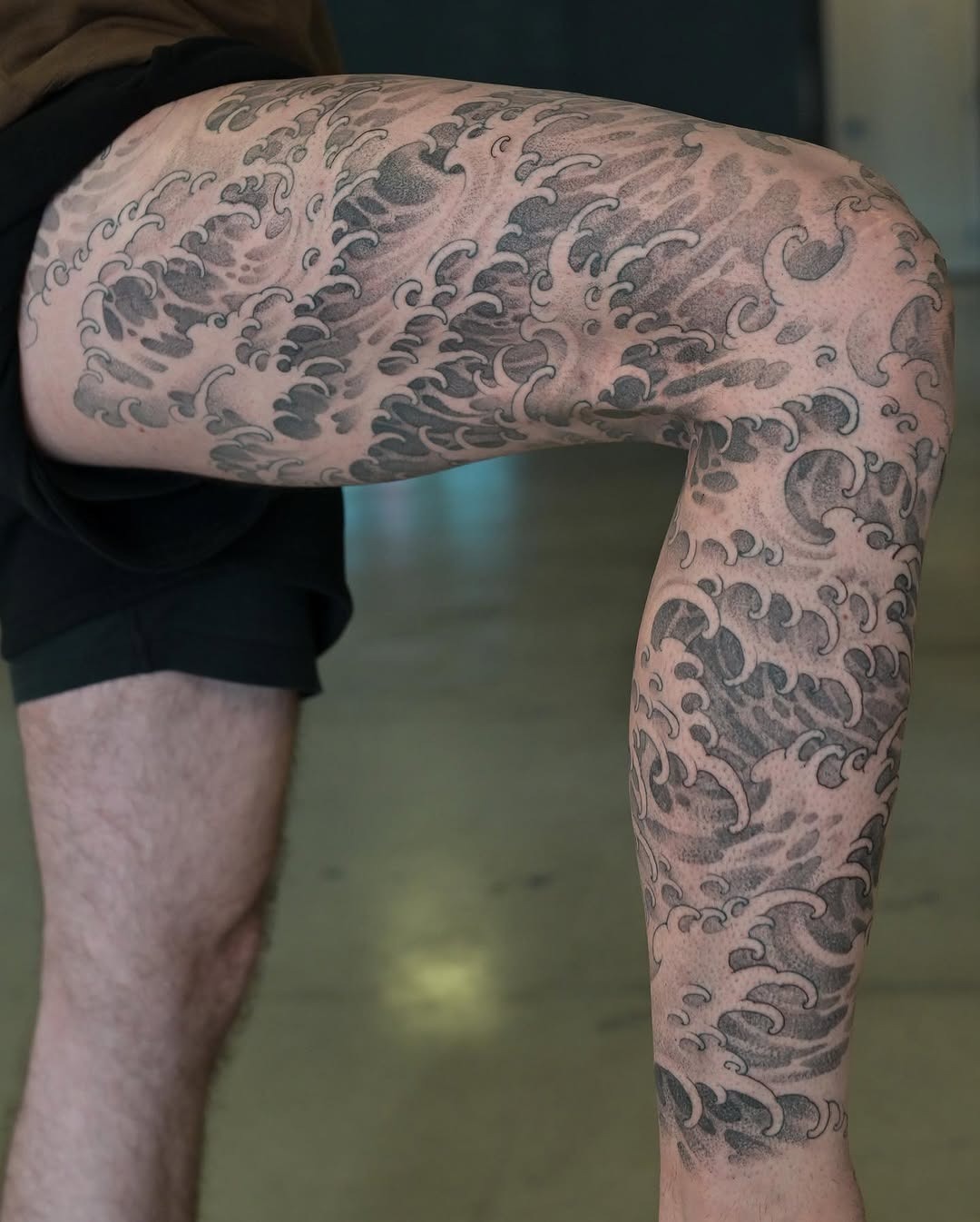 Stunning leg tattoo inspired by ocean waves Tattoo Design