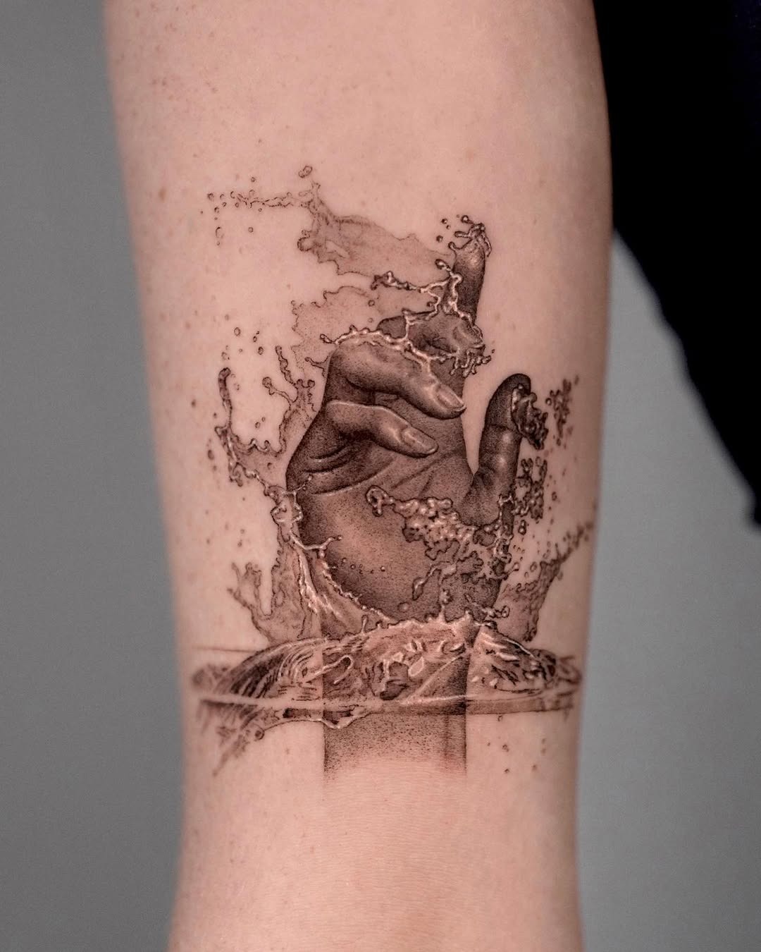Stunning Water Tattoo Creating Motion and Depth Tattoo Design